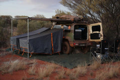 Two Stretcher Tents beside a 4WD at a remote bush campsite under a Wildtrak-style awning.