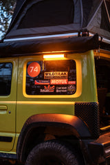 Wildtrak Base 300 Multi Light illuminating campsite outdoors