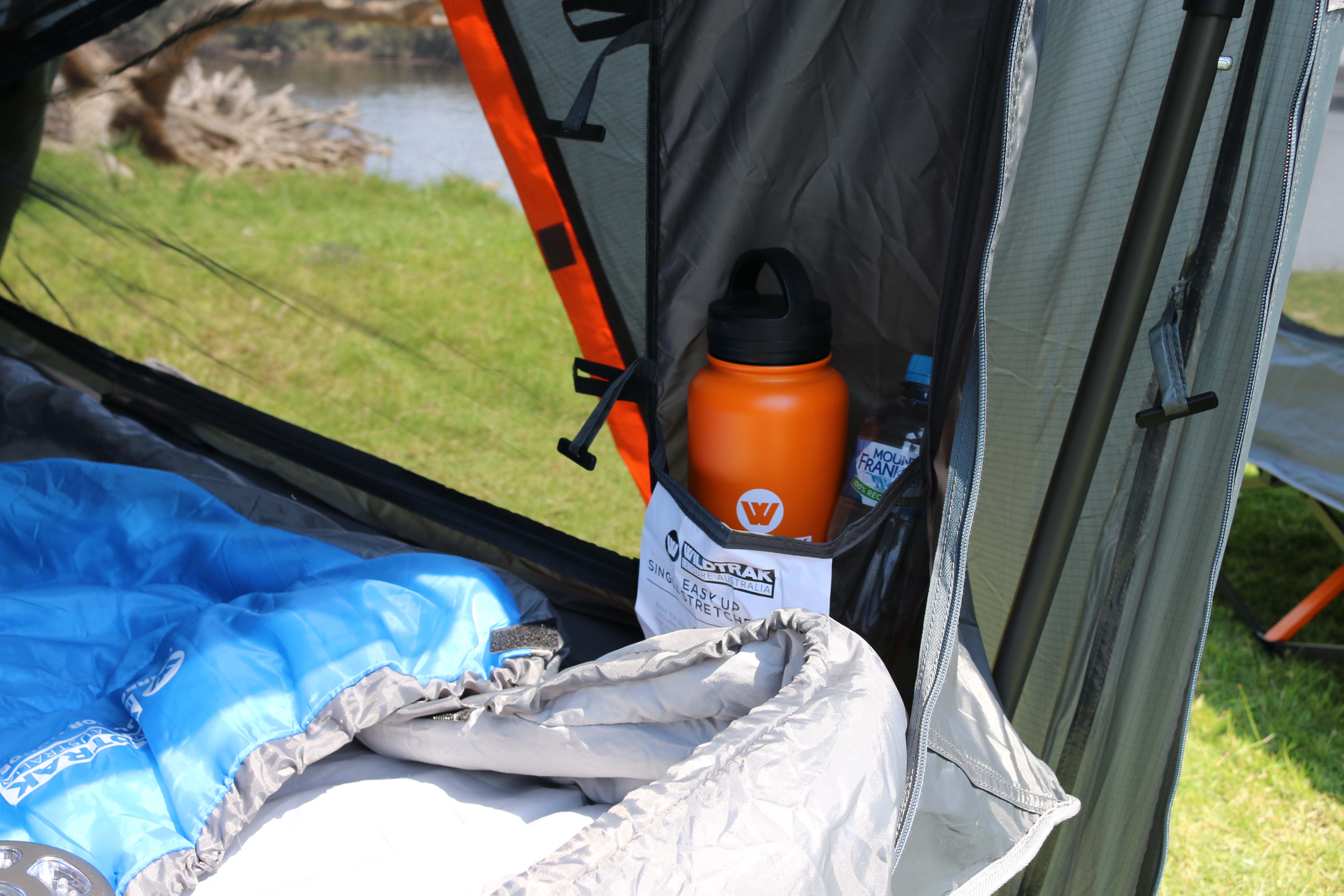 Wildtrak Leisure Australia Stretcher Tent with open canopy for airflow and outdoor rest.