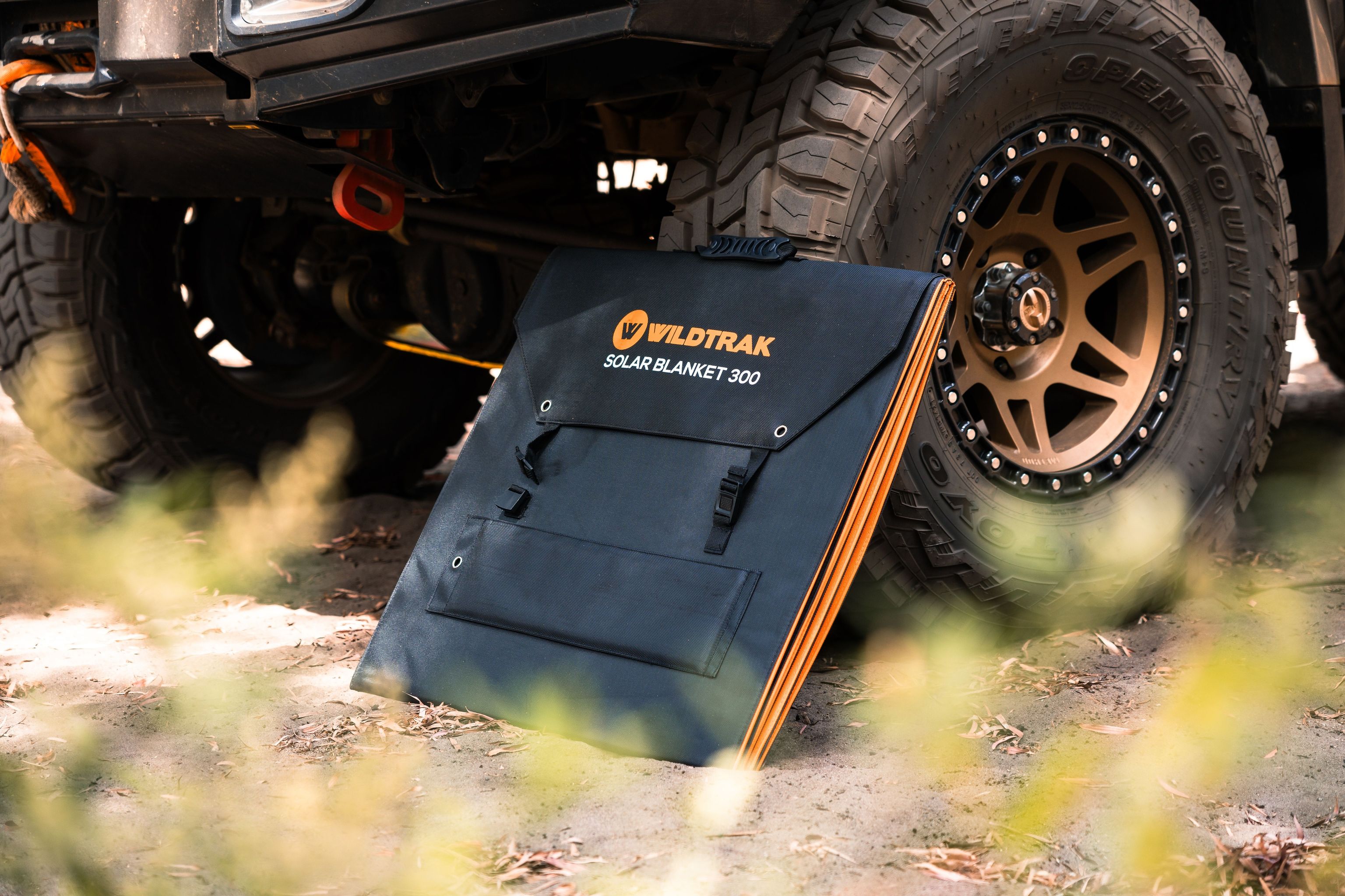 Wildtrak™ 300W Folding Solar Blanket (A-Grade with ETFE Coating, Built in Stand, IP65 Waterproof & Carry Bag) for Off-Grid Living, Camping, 4WD & Caravan Adventures