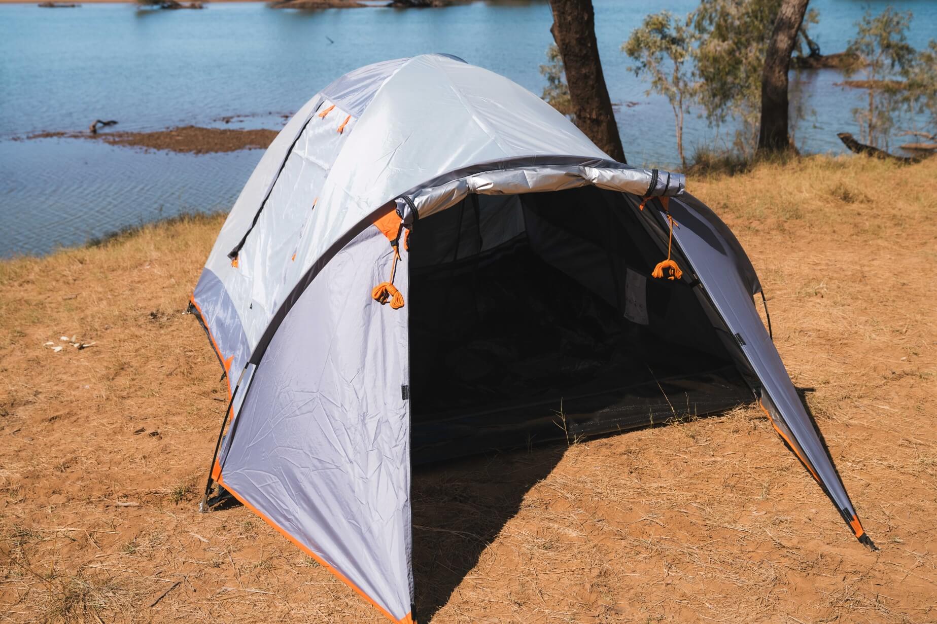 Durable camping shelters and spacious tents from Wildtrak Leisure Australia arranged outdoors.
