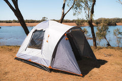 Wildtrak Leisure Australia showcasing a single rugged tent set beside modern camping shelters in a forest.